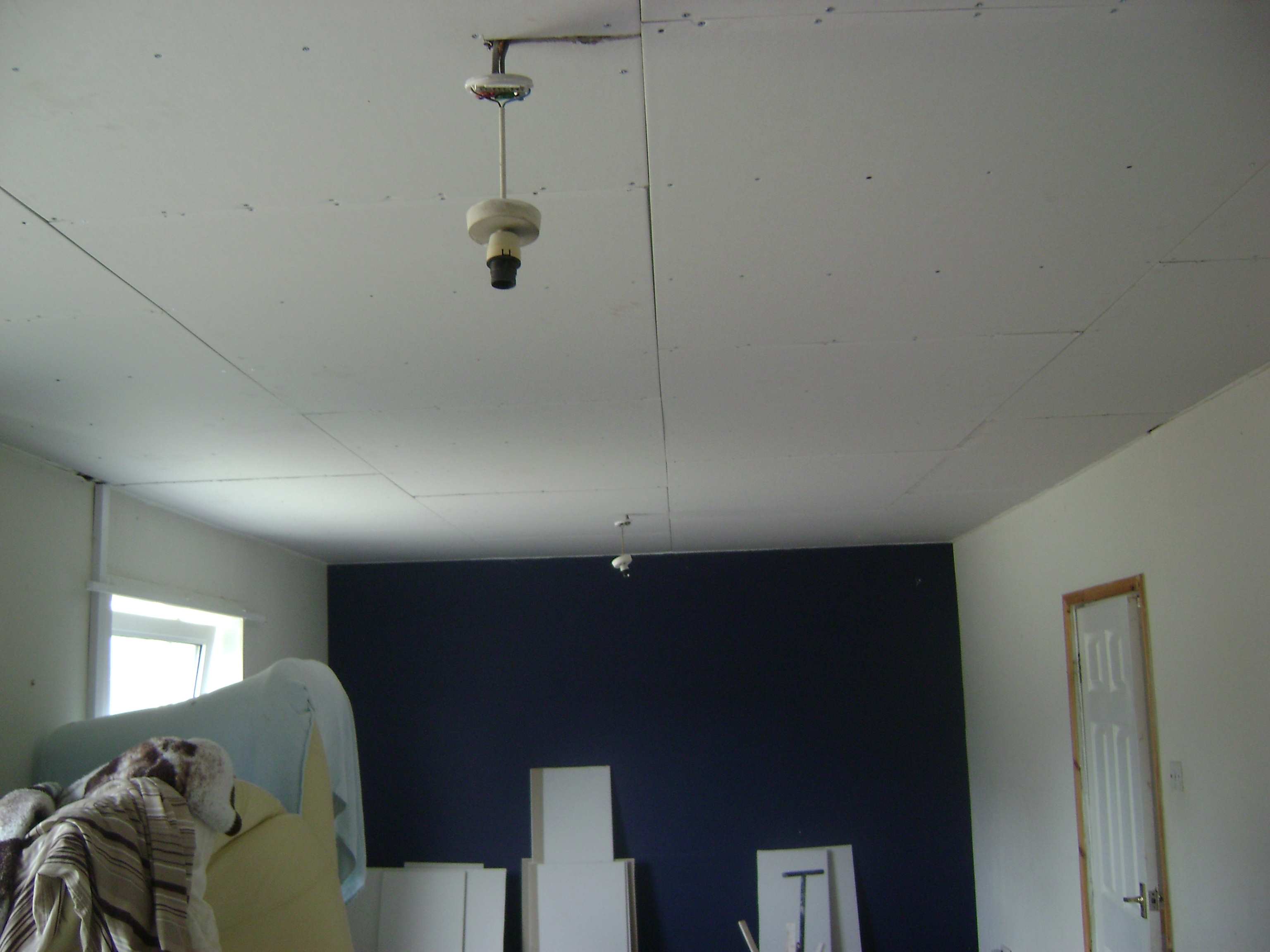 Following removal of the timber battens, the joists were located and the ceiling was overboarded
