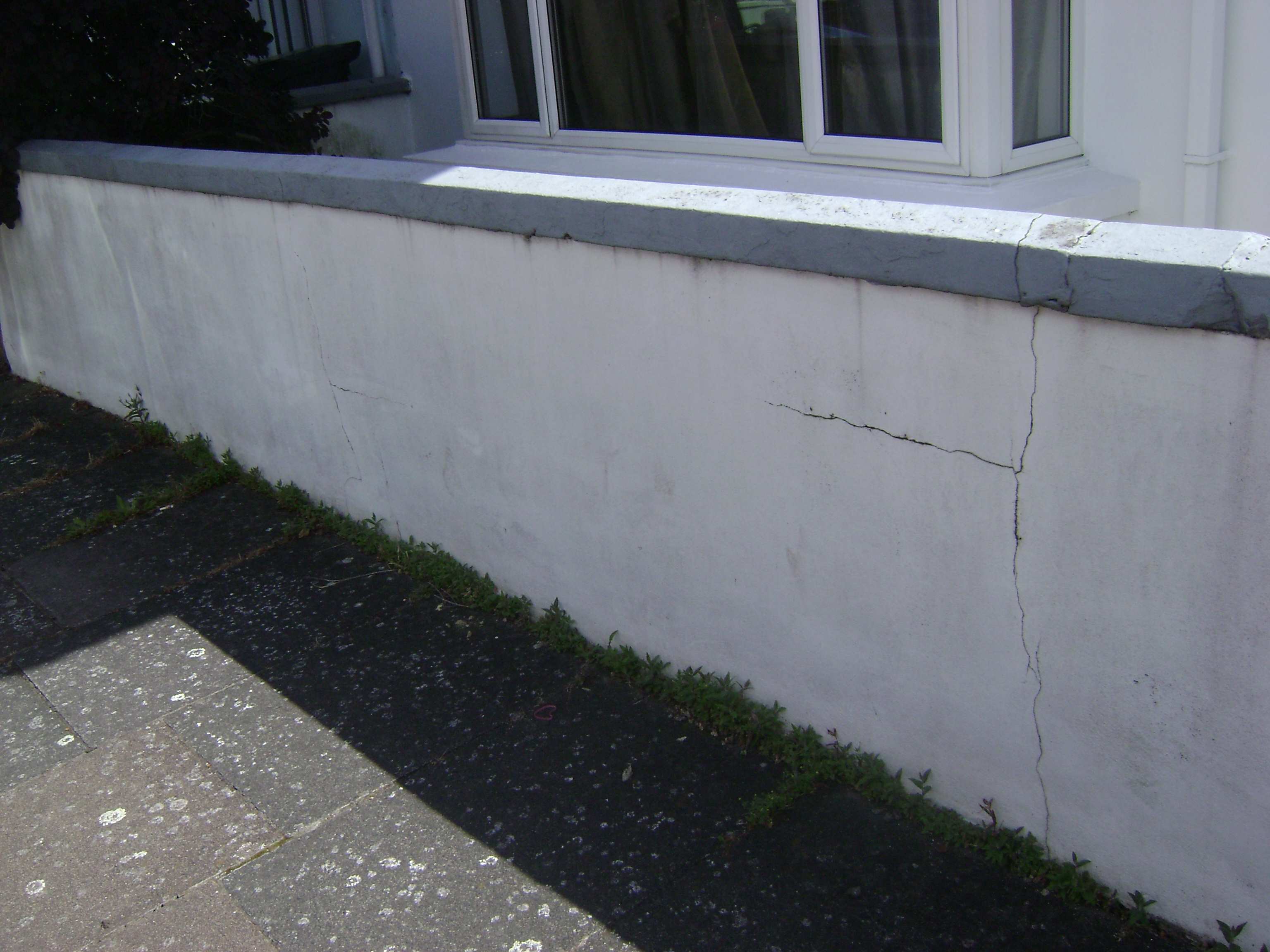 This garden wall had become badly cracked and blown over the years